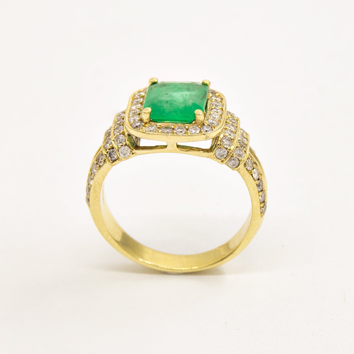 Anel esmeralda dois aros volta diamantes 